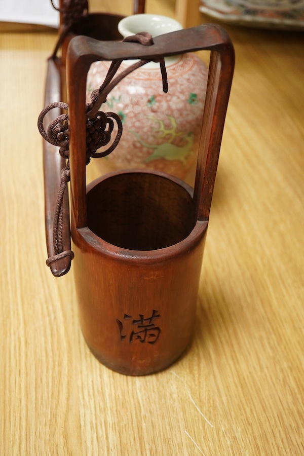 A Chinese famille verte jar, 19cm high together with a miniature bamboo ‘water carrier’, largest 51cm wide. Condition - vase good, carrier, poor